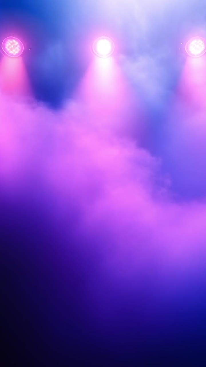 Bold lighting sets vibrant mood. Colorful stage lights illuminate a foggy environment, creating an engaging and dynamic ambiance for a performance.