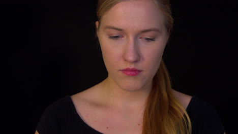 Depressed-woman-on-black-background