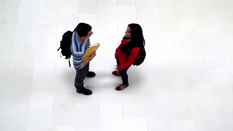 two students meeting in the hallway