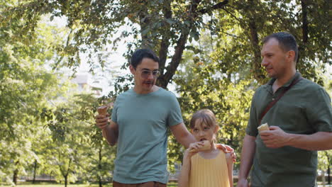 lgbtq family walking in park