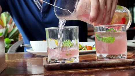 pouring pink cocktails