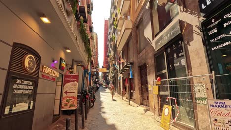 busy street scene with shops and pedestrians