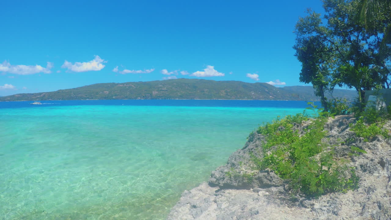 Alluring View of a Beach With Mountains, Tress, and Rocks in the Background, Sumilon Island, Cebu, Philippines