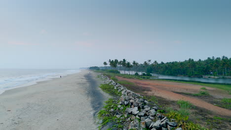 Morning-on-the-beach,-sand,-palm-trees-and-the-sea