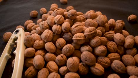 Young-man-is-cracking-some-fresh-dried-walnuts