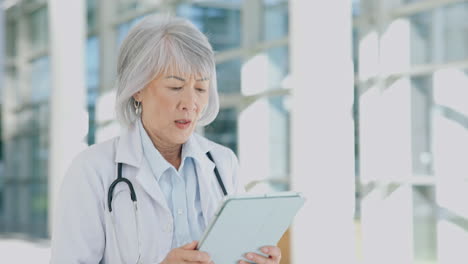 doctor, woman and walking with tablet in hospital