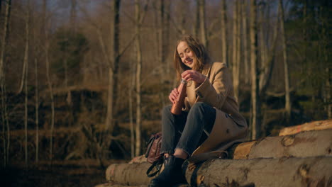 woman in mountains drinking coffee