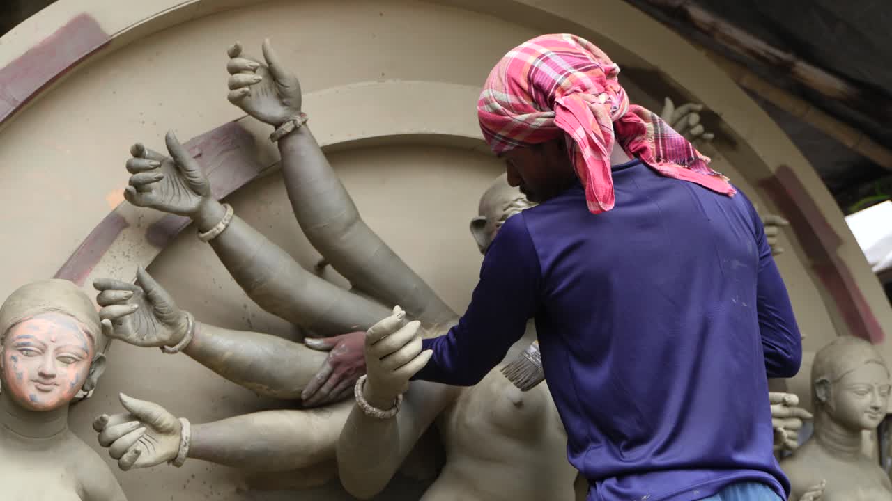 In Kumortuli, idol artists are making idols of Durga, the revered deity of Hinduism. The work of making these idols starts from June and these potters make many idols till November.