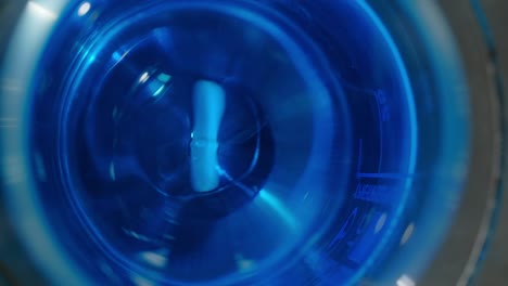 pill in blue liquid