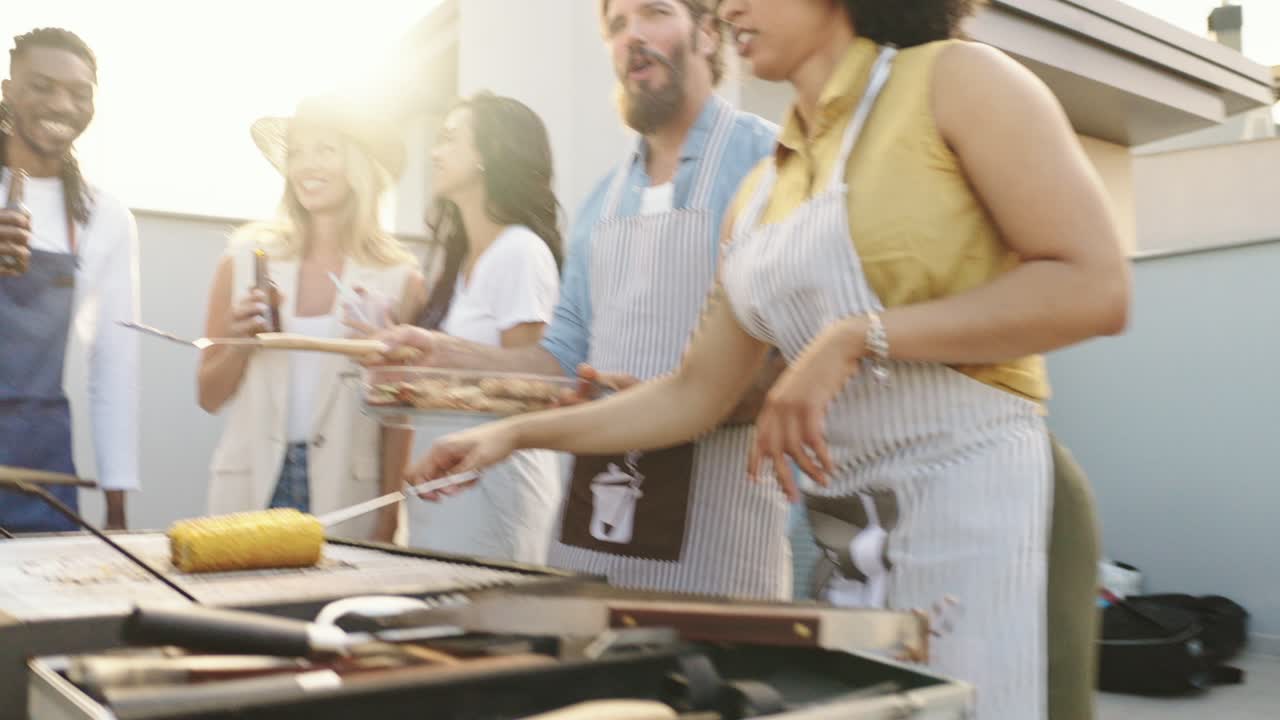 Group of friends grilling outdoors