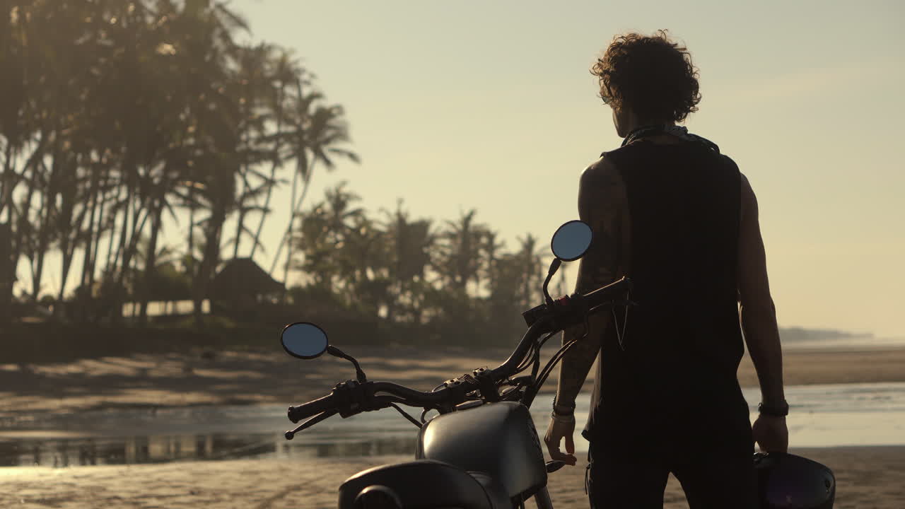 Motorcycle Adventure on a Tropical Beach at Sunrise