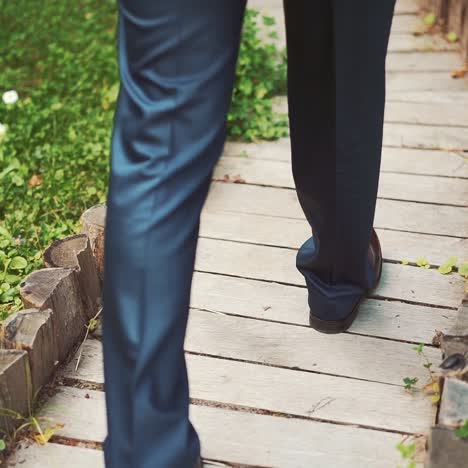 close up of an elegant male shoes walking on the street. slow motion.