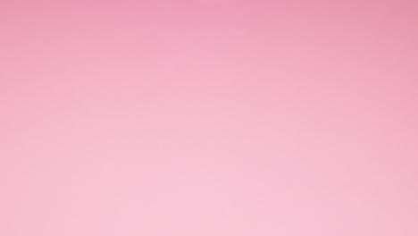 las rondas coloridas aparecen y desaparecen desde el fondo rosa - detenga el movimiento