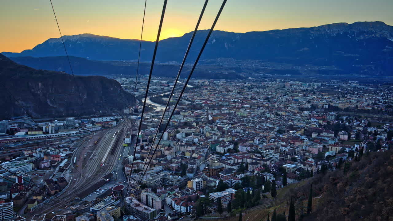 Aerial view from a cableway of a village in the Dolomites, Italy at sunset