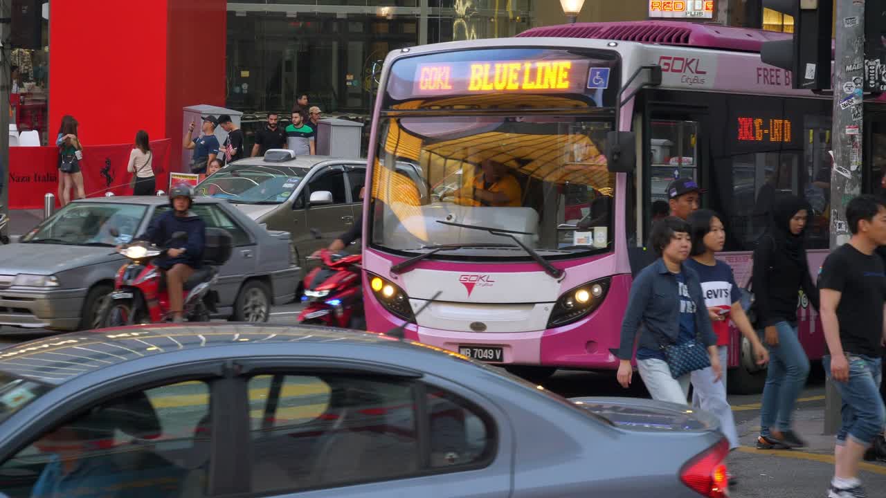 evening time kuala lumpur city center famous traffic street crowded slow motion panorama 4k malayisa