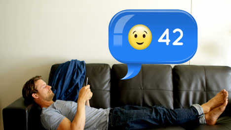Man-lying-on-a-couch-while-texting-4k