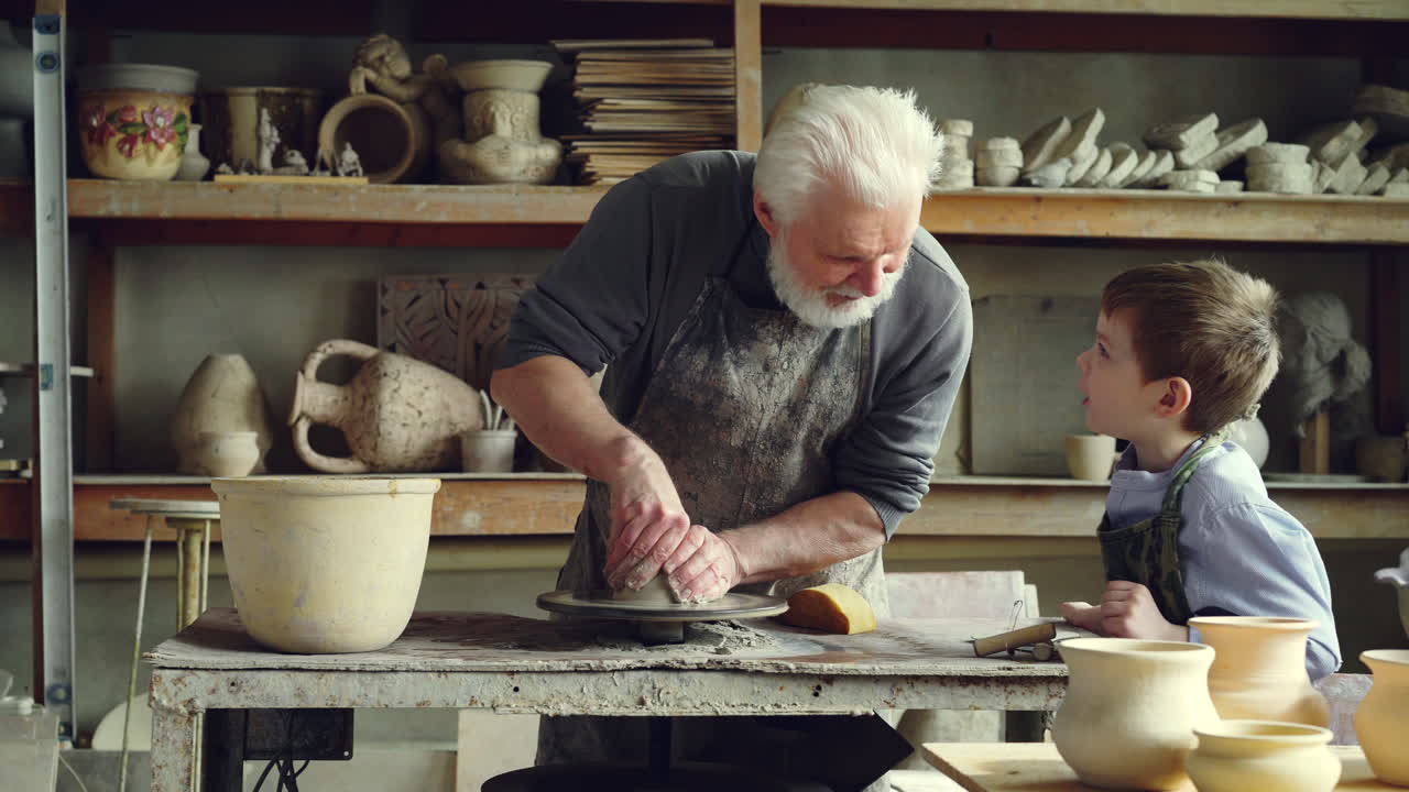 Grandfather and Grandson Making Pottery
