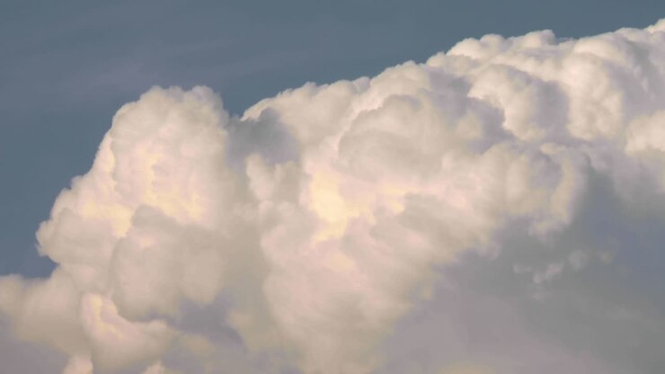 Billowing clouds, cumulonembus growing a storm