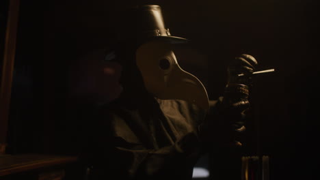 plague doctor in dark room