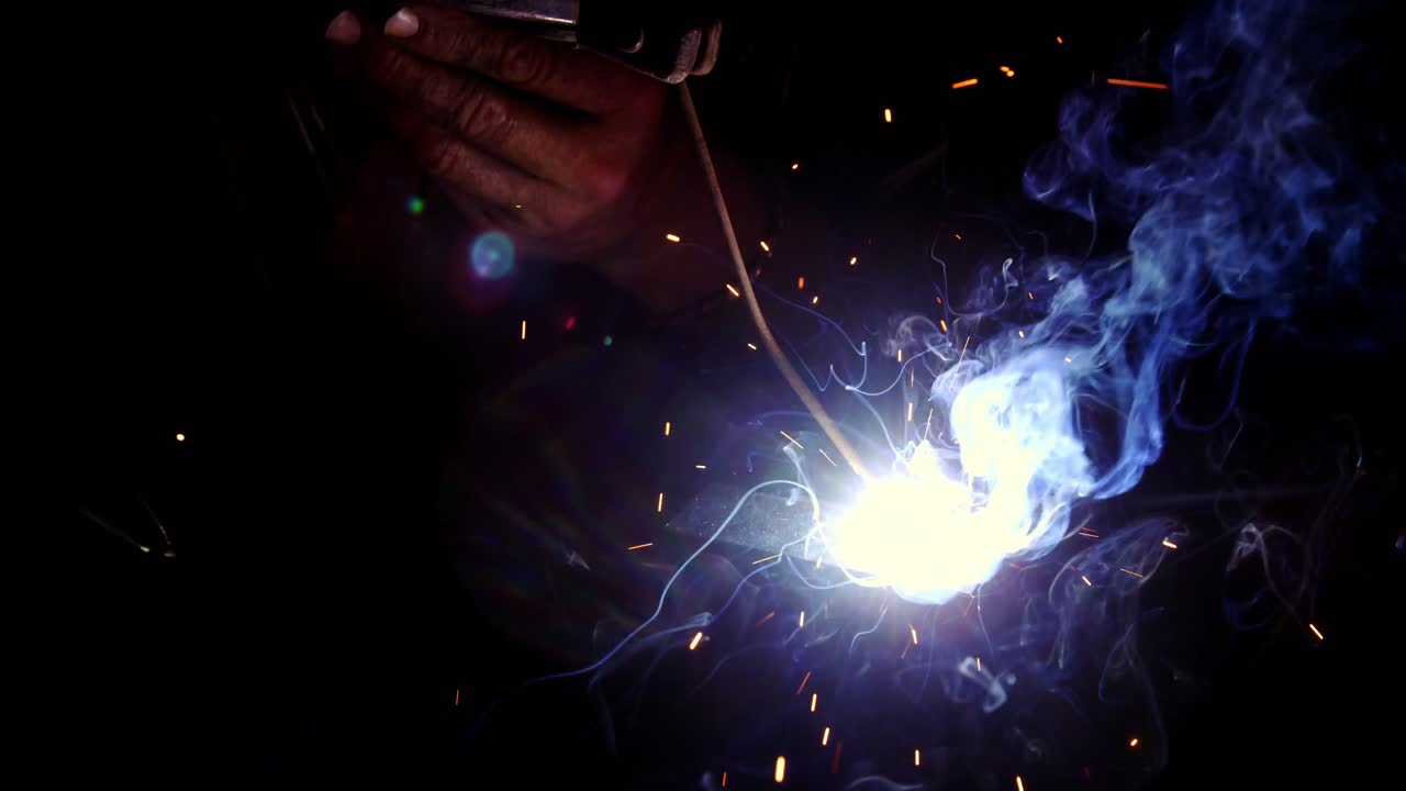 Welder working on a piece of metal