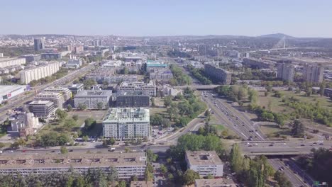 Amazing-aerial-shot-of-New-Belgrade-highway-and-roundabout,-Serbia-4k-summer-day