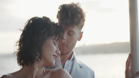 couple in love on a boat at sunset