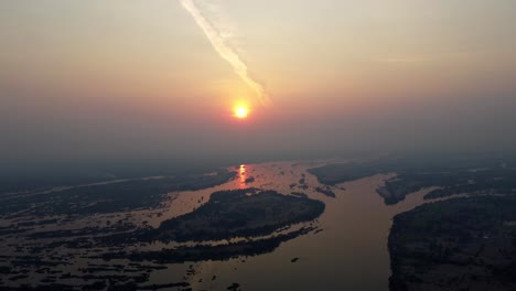 a magical sunset over the mekong river, the so called 4000 islands in the south of laos