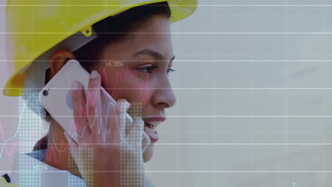 animation of data processing and diagrams over biracial female worker talking on smartphone