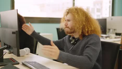 angry worker experiencing computer problems in a coworking