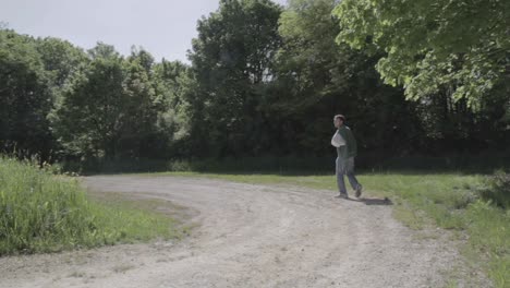 Hitchhiker-sees-vehicle-coming-and-attempting-to-flag-it-down