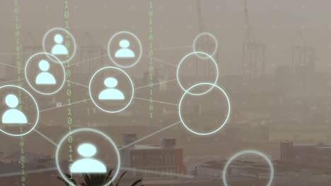 Animation-of-network-of-connections-with-icons-and-binary-coding-over-cityscape