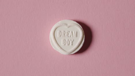 heart candy with dream boy message on pink background