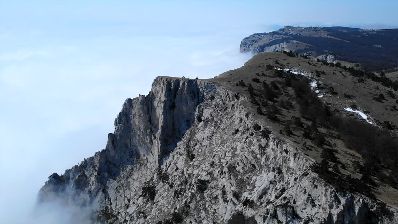 Mountain cliff with fog