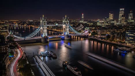 tower bridge and london skyline at night