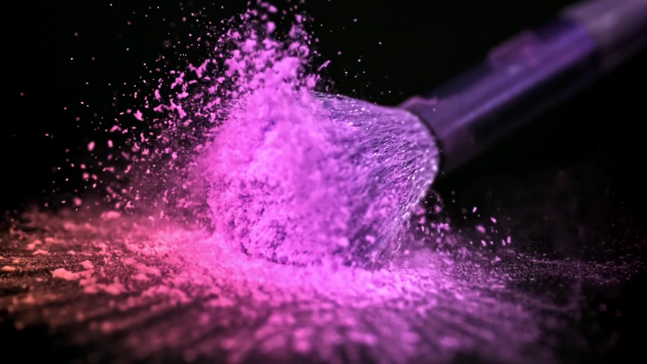 Slow Motion of Makeup Brush Pressing into Vibrant Pink Powder