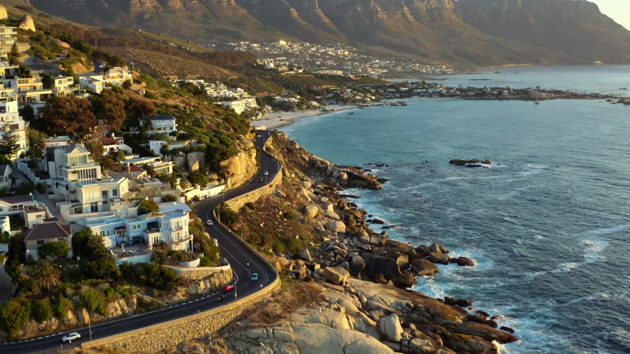 Sunset in Capetown south africa with coastal roads and ocean