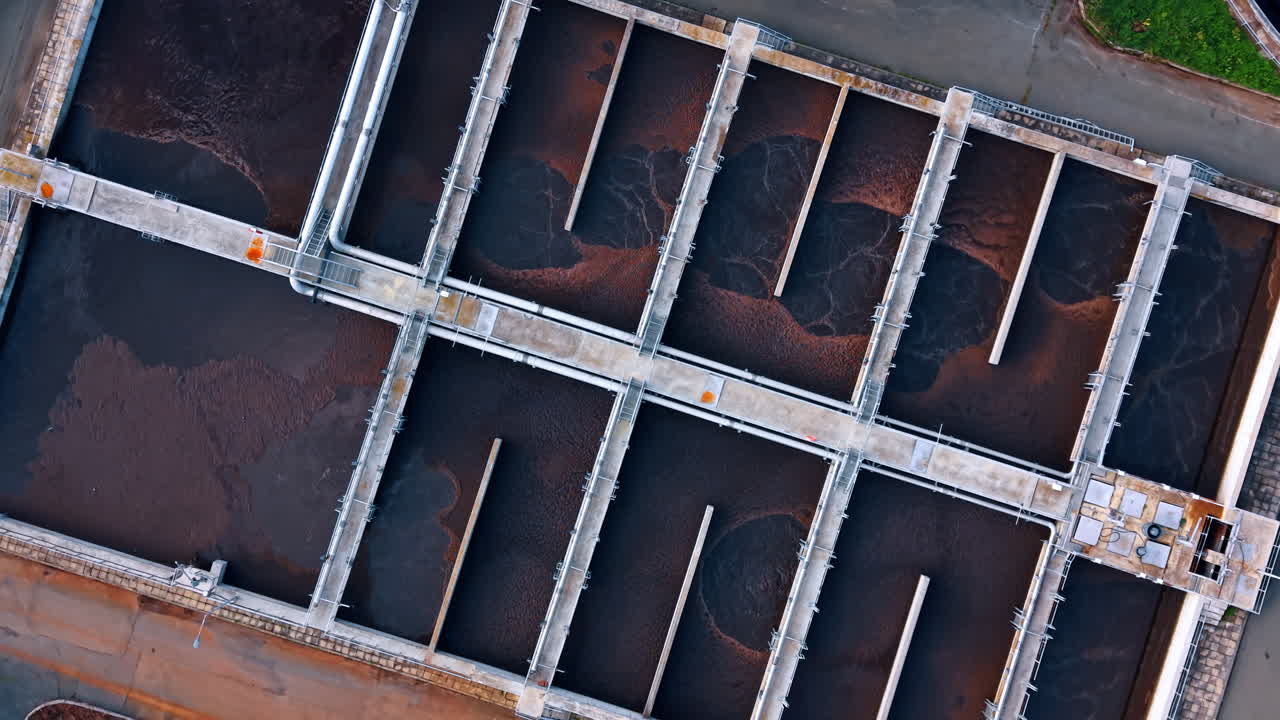 Large reservoirs are being filled with dirty sewage water. Recycling waste water at the water treatment plant. Top view