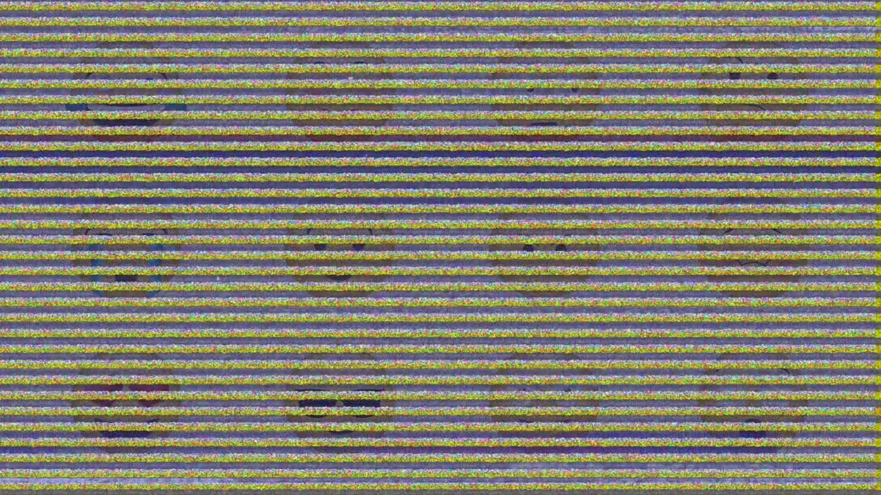 Digital animation of tv static effect over multiple face emoji against grey background