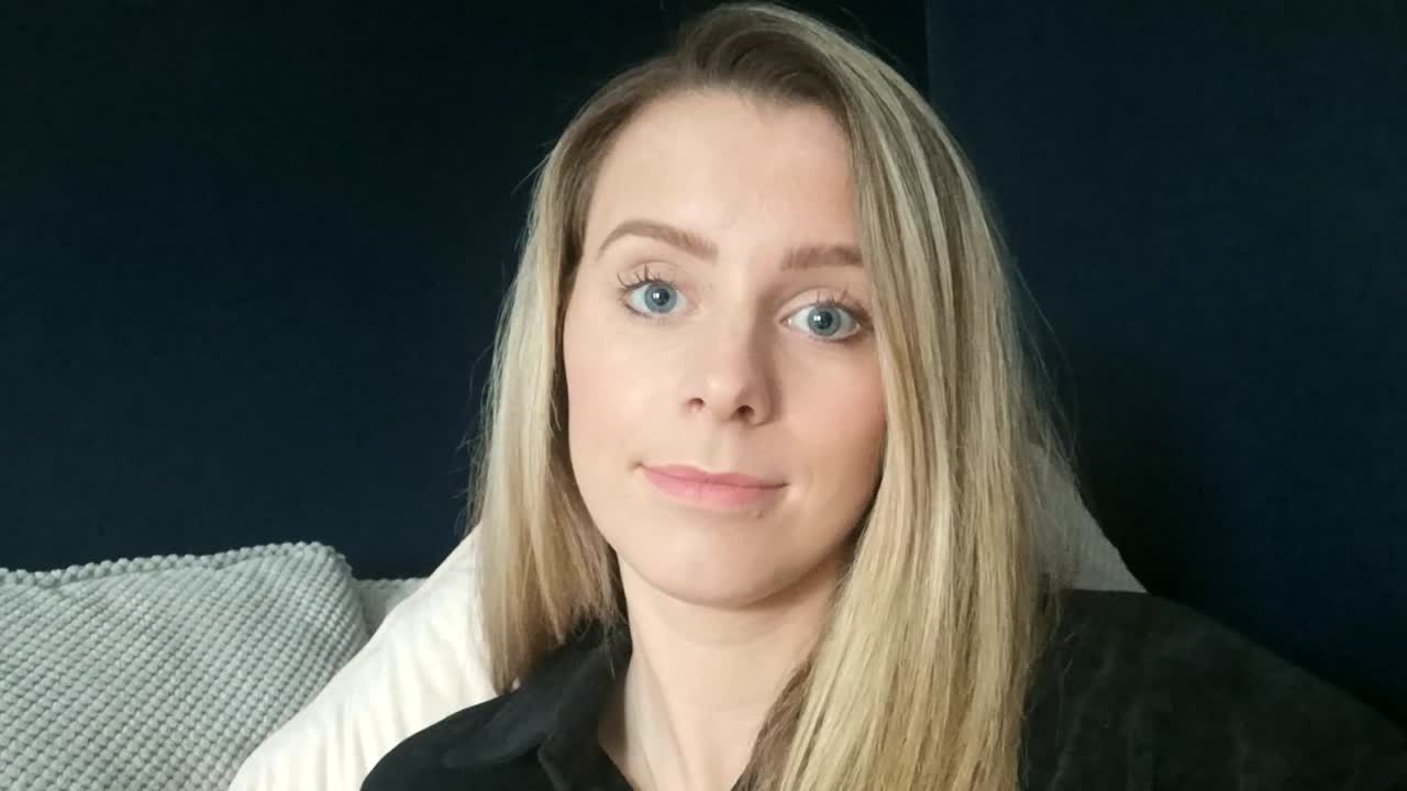 Woman Saying Cheers To The Camera On Video Call