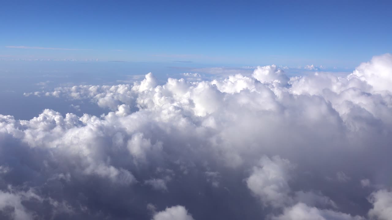 View of clouds in the blue sky from plane