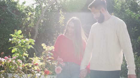 video of happy caucasian couple spending time in the garden