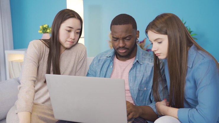 Young people of different races brainstorming about a topic.