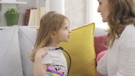 Mom-spends-time-playing-games-with-her-little-daughter.