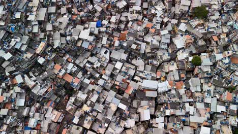 flyover above favela rocinha capturing the colorful homes, bustling activity, and culture of the community