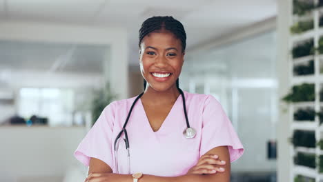 Black-woman-doctor,-face-and-smile-at-hospital