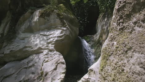 small waterfall in a rocky canyon