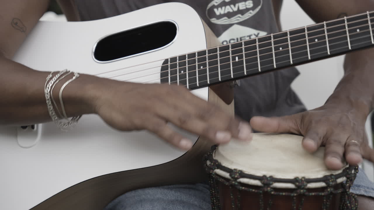 man playing guitar closeup
