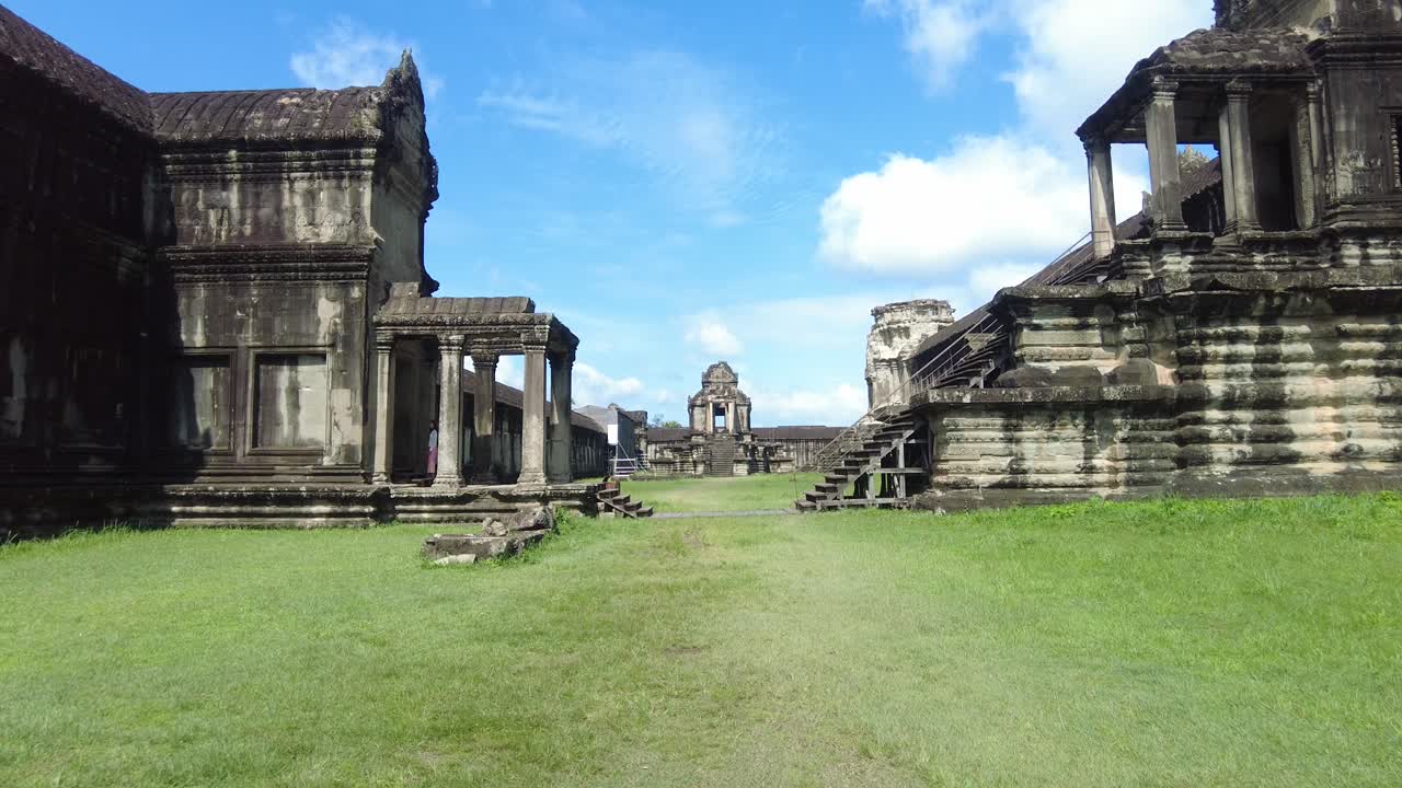The Ruins Of Angkor Wat Hindu-Buddhist Temple Complex In Cambodia. Aerial Pullback Shot