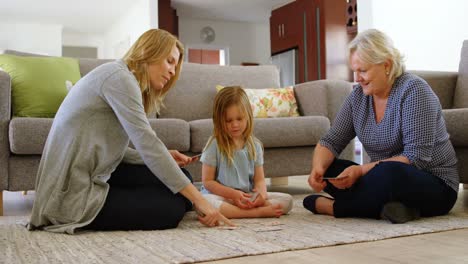 multi-generation family playing cards in living room 4k