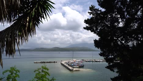 Framed-shot-looking-down-on-Kouloura-harbour,-Corfu,-Greece